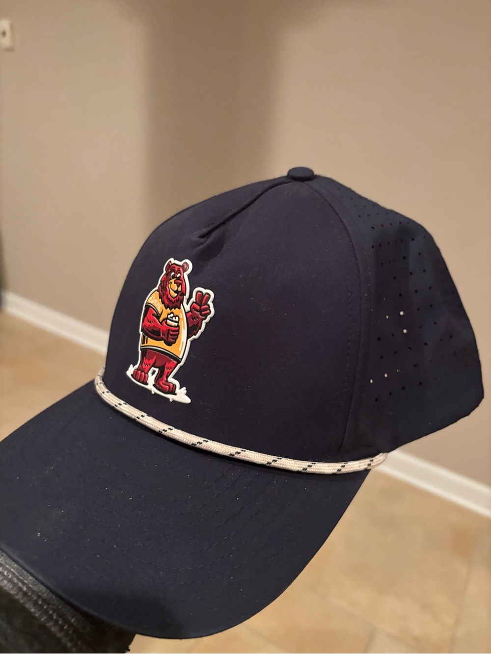 Crafted Men's Navy Perforated Baseball Cap with Colorful Mascot Bear Patch